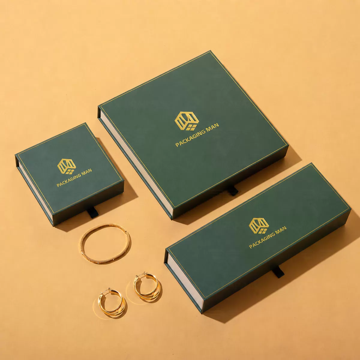 Green rigid packaging boxes with gold bangles