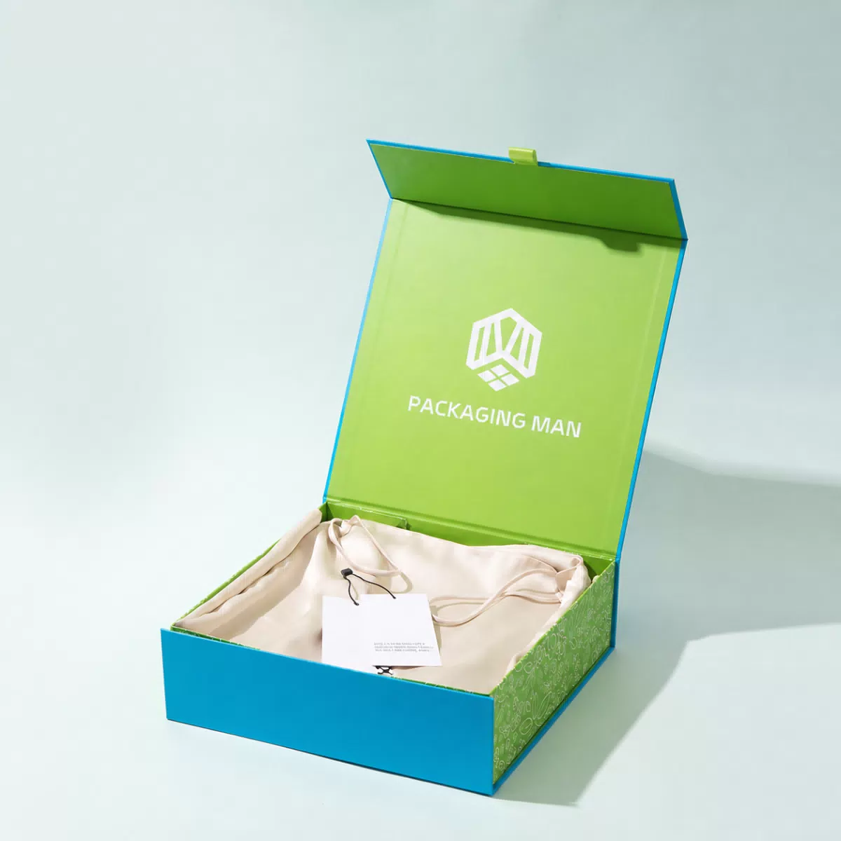 Blue gift box with beige pouch inside