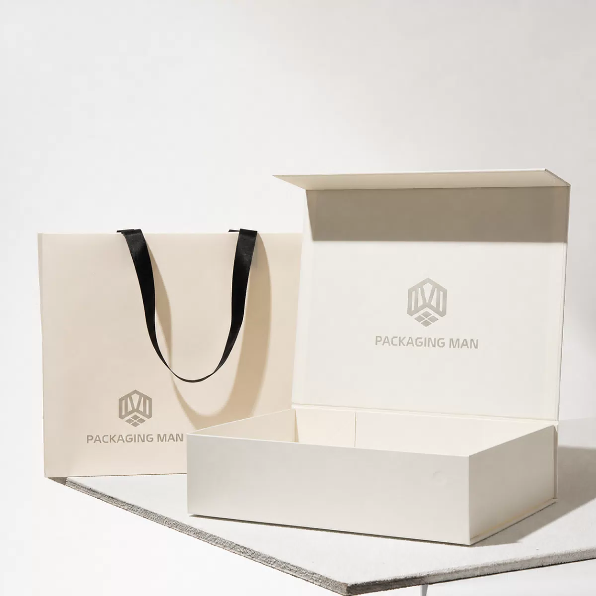 Open cream rigid gift box and paper bag