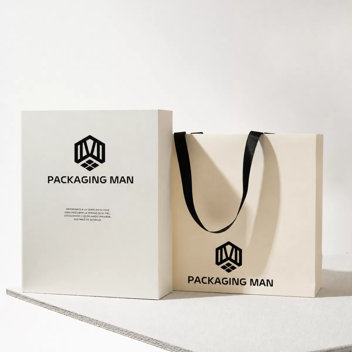 Closed cream rigid box next to paper bag
