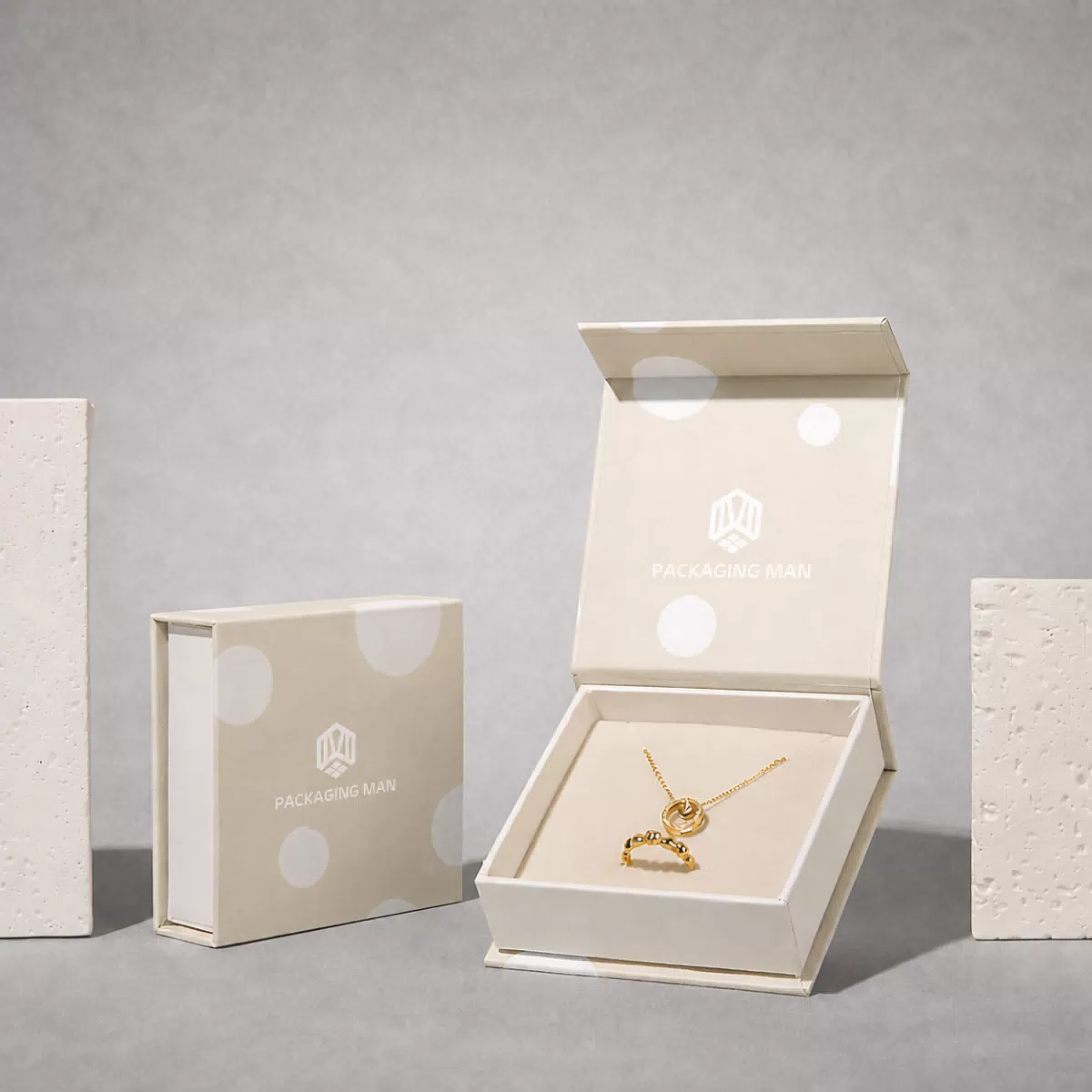 Open beige rigid gift box with necklace