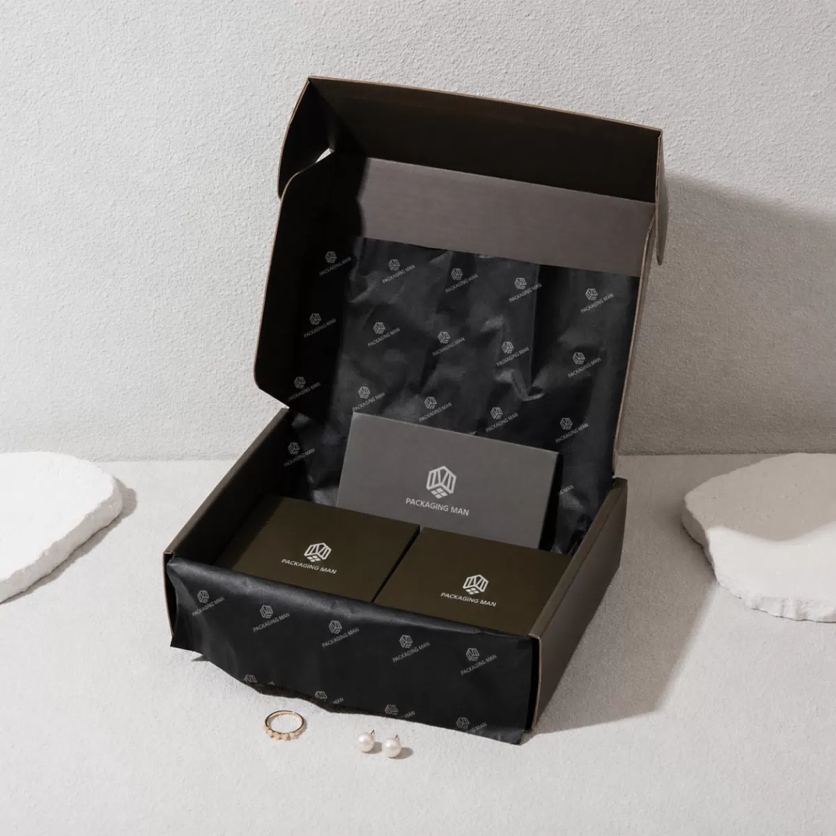 Open dark mailer box with tissue paper