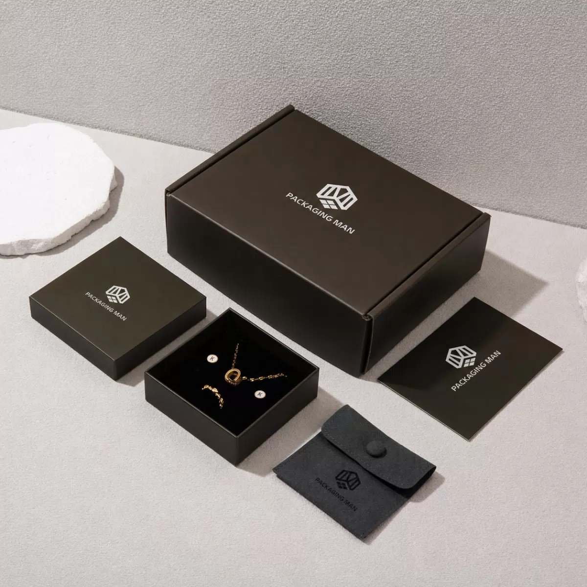 Closed dark gift box with small boxes