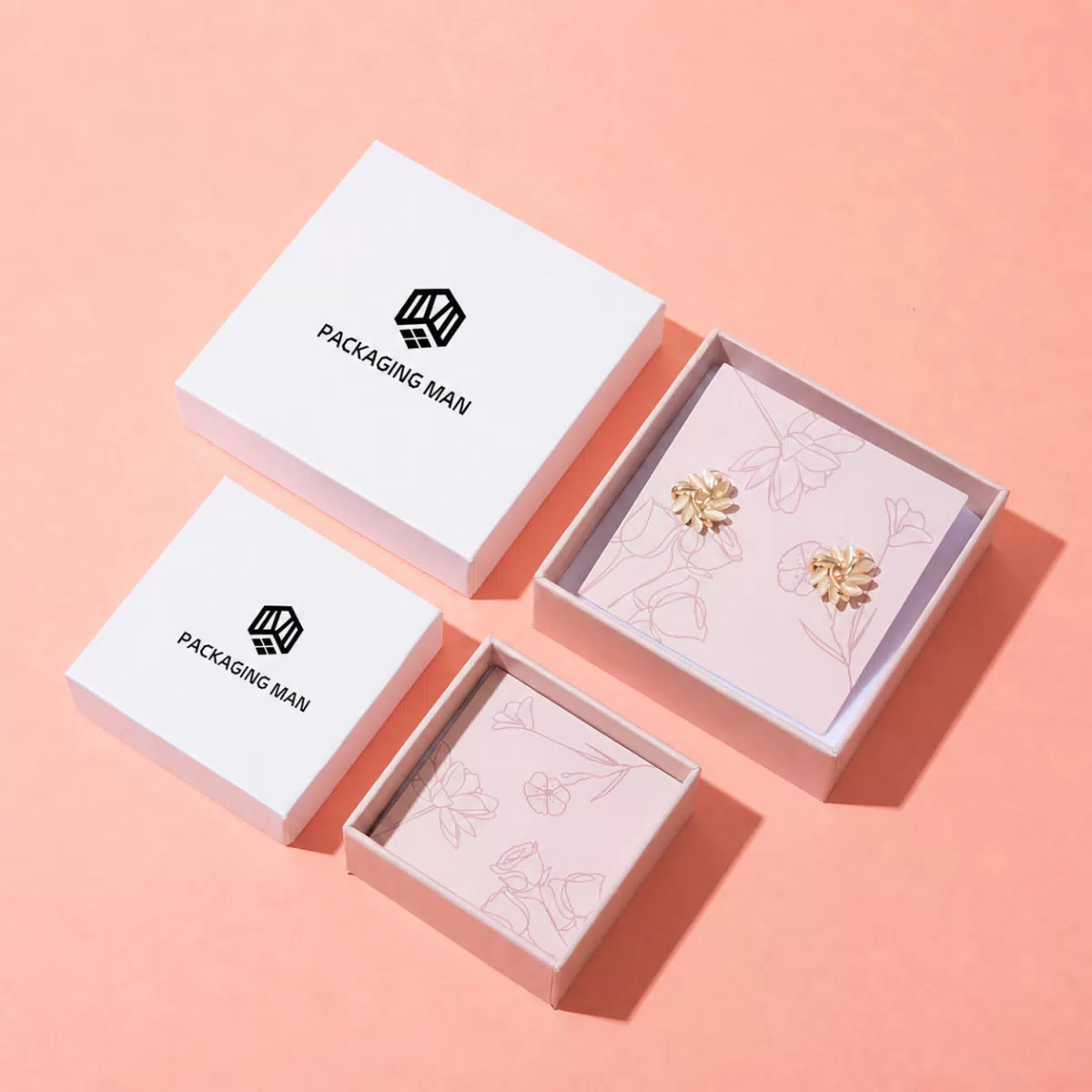 Open white gift boxes with floral insert cards