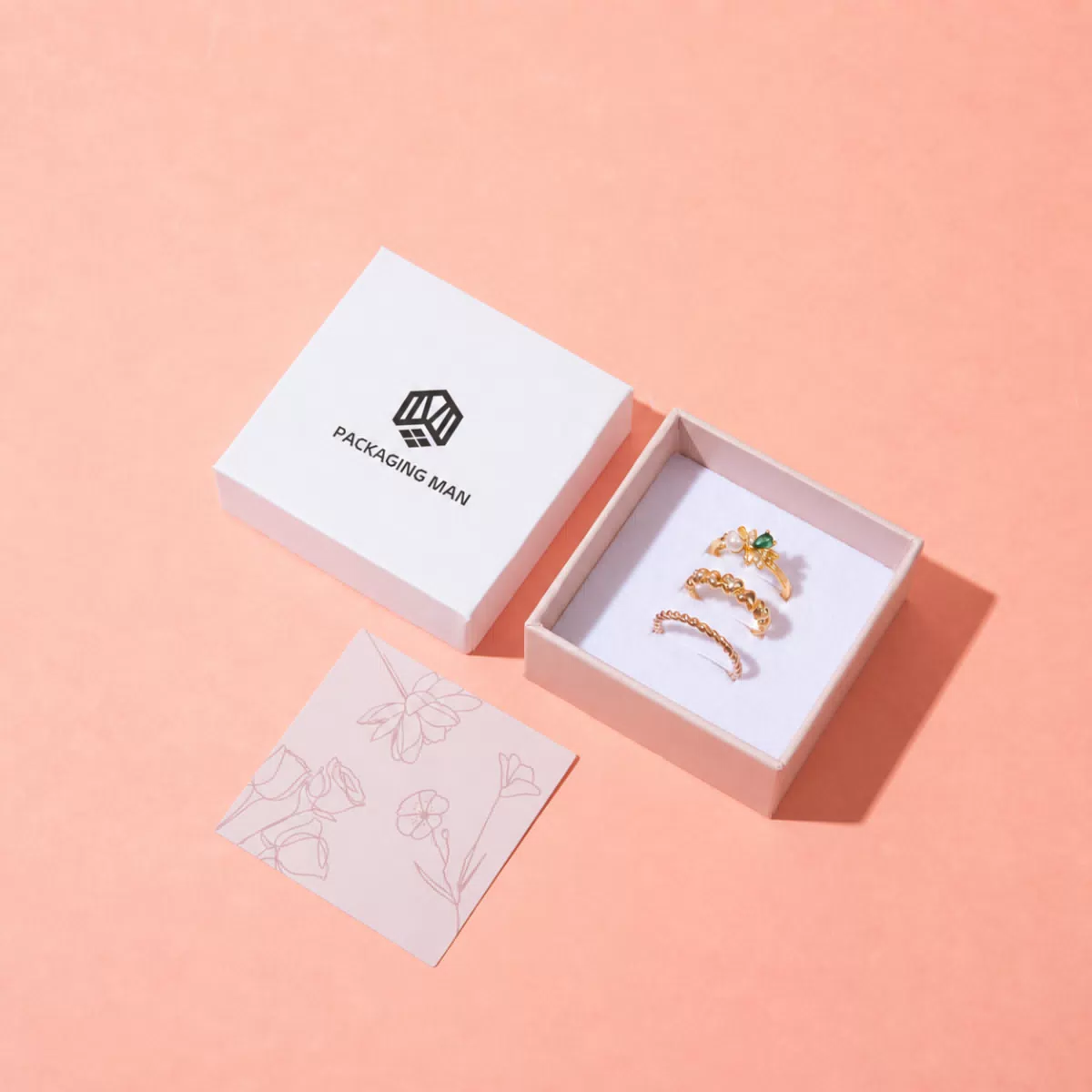 White gift box packaging with gold rings