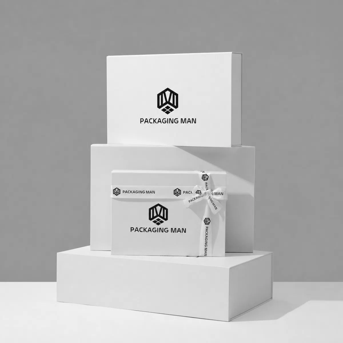 Stacked white rigid gift boxes