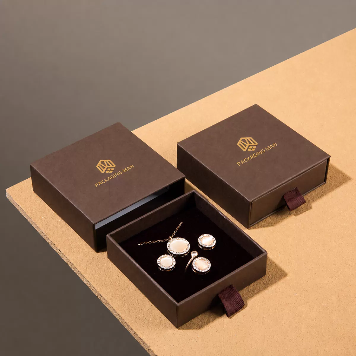 Two dark brown drawer boxes on table