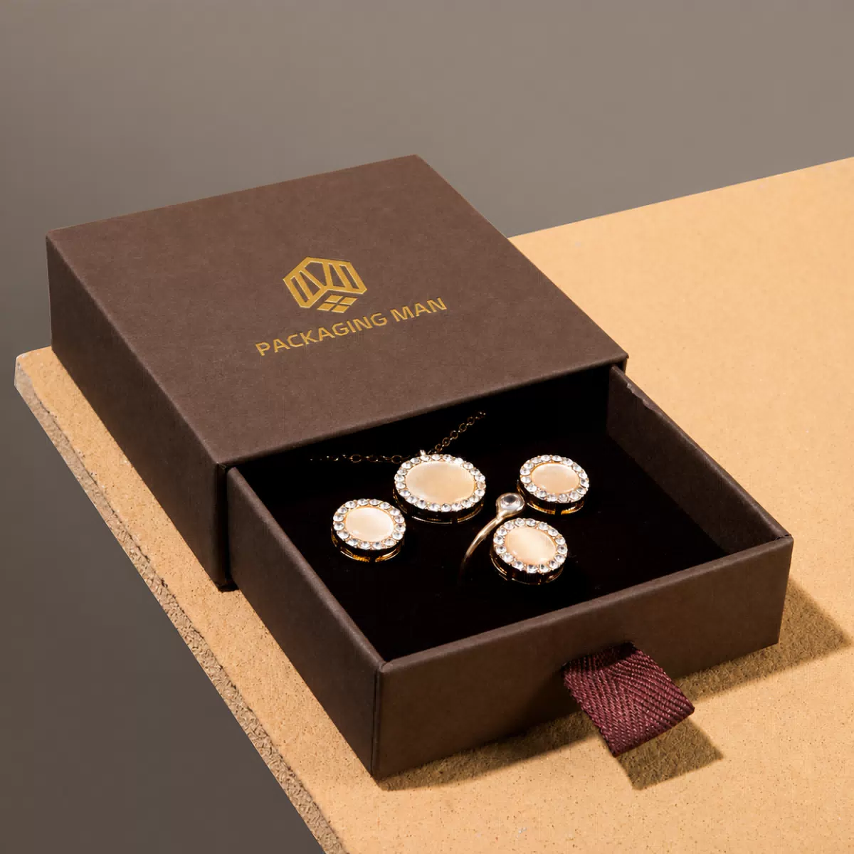 Dark brown drawer box containing jewelry set