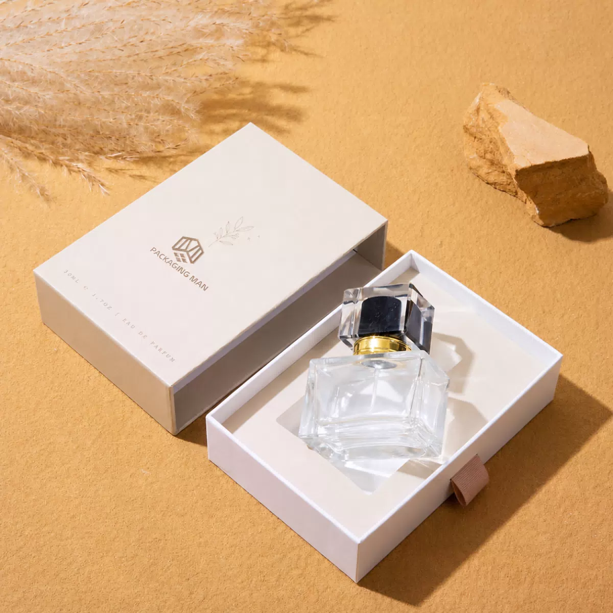 White sliding gift box with glass bottle