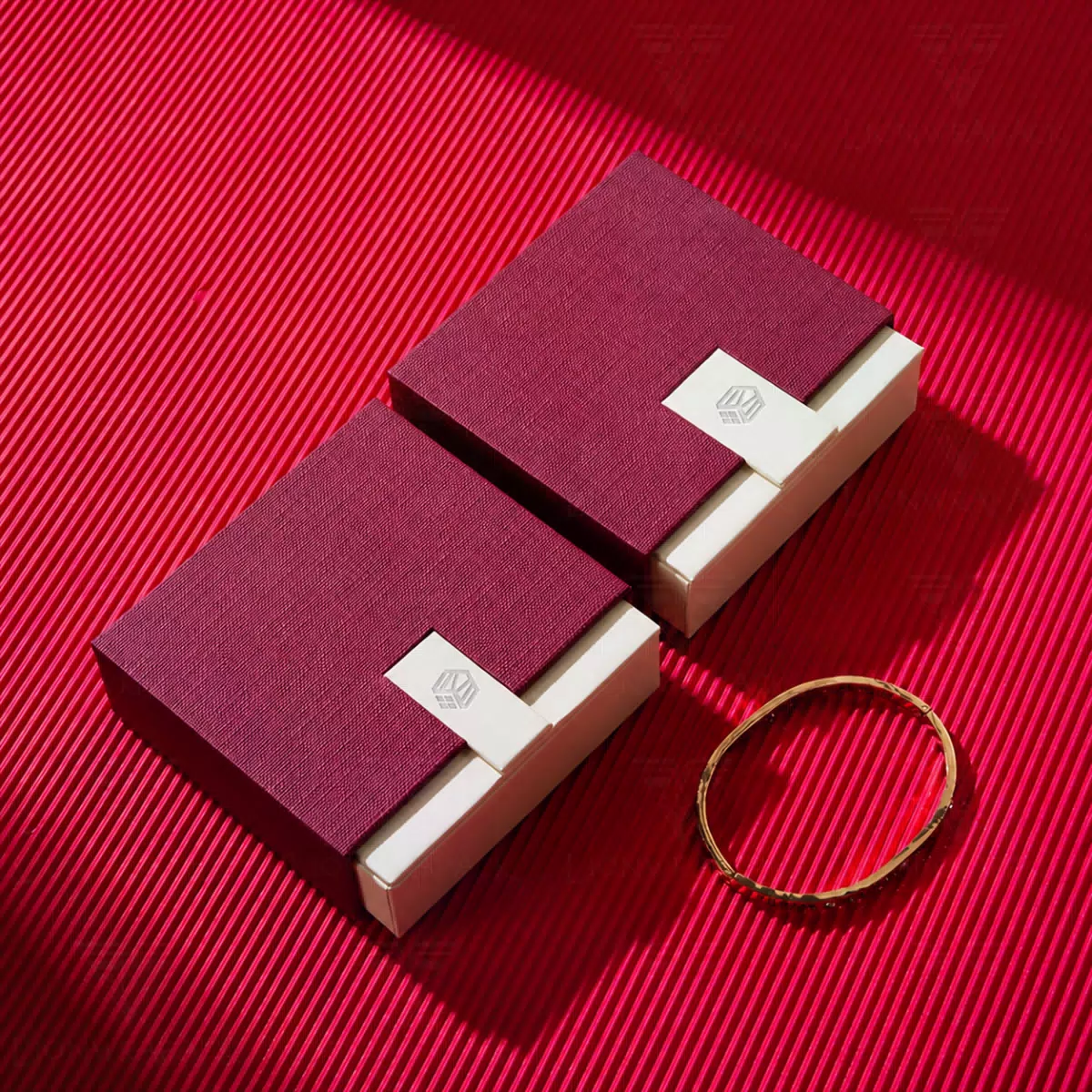 Burgundy rigid gift boxes with white accents