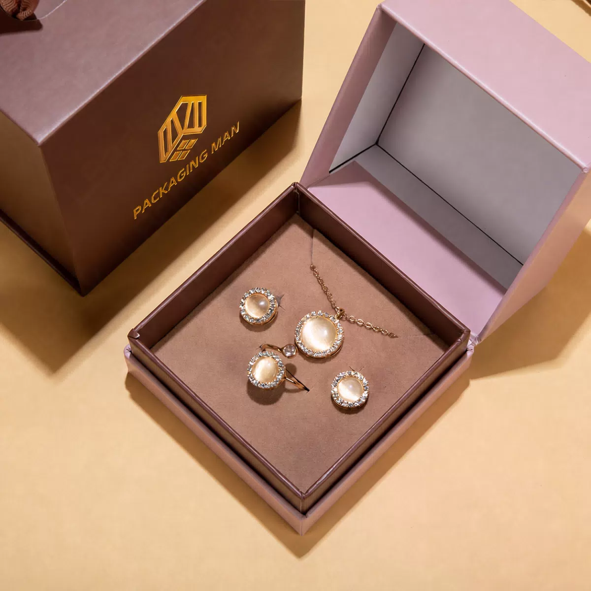 Open pink gift box with jewelry insert tray
