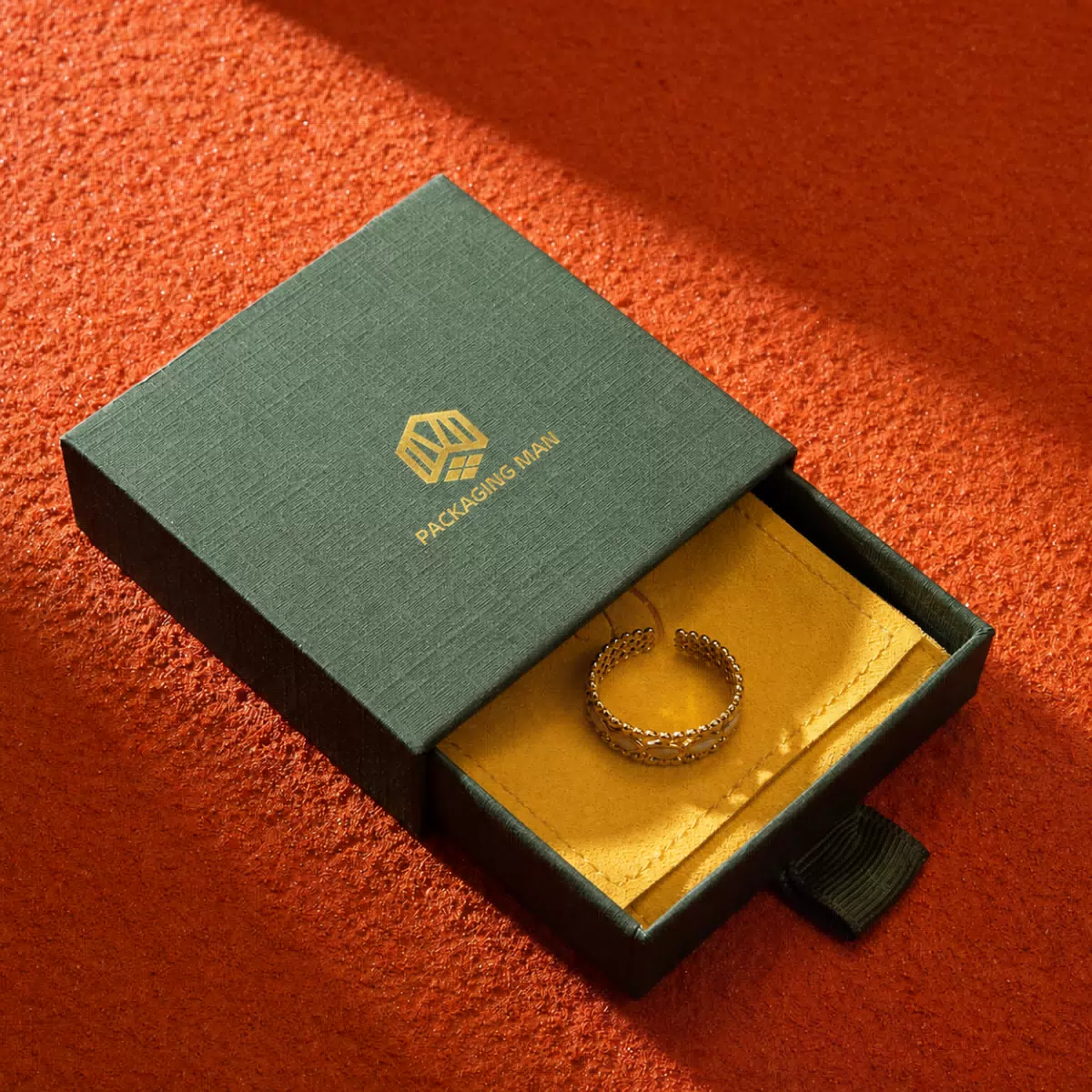 Open green drawer box with ring
