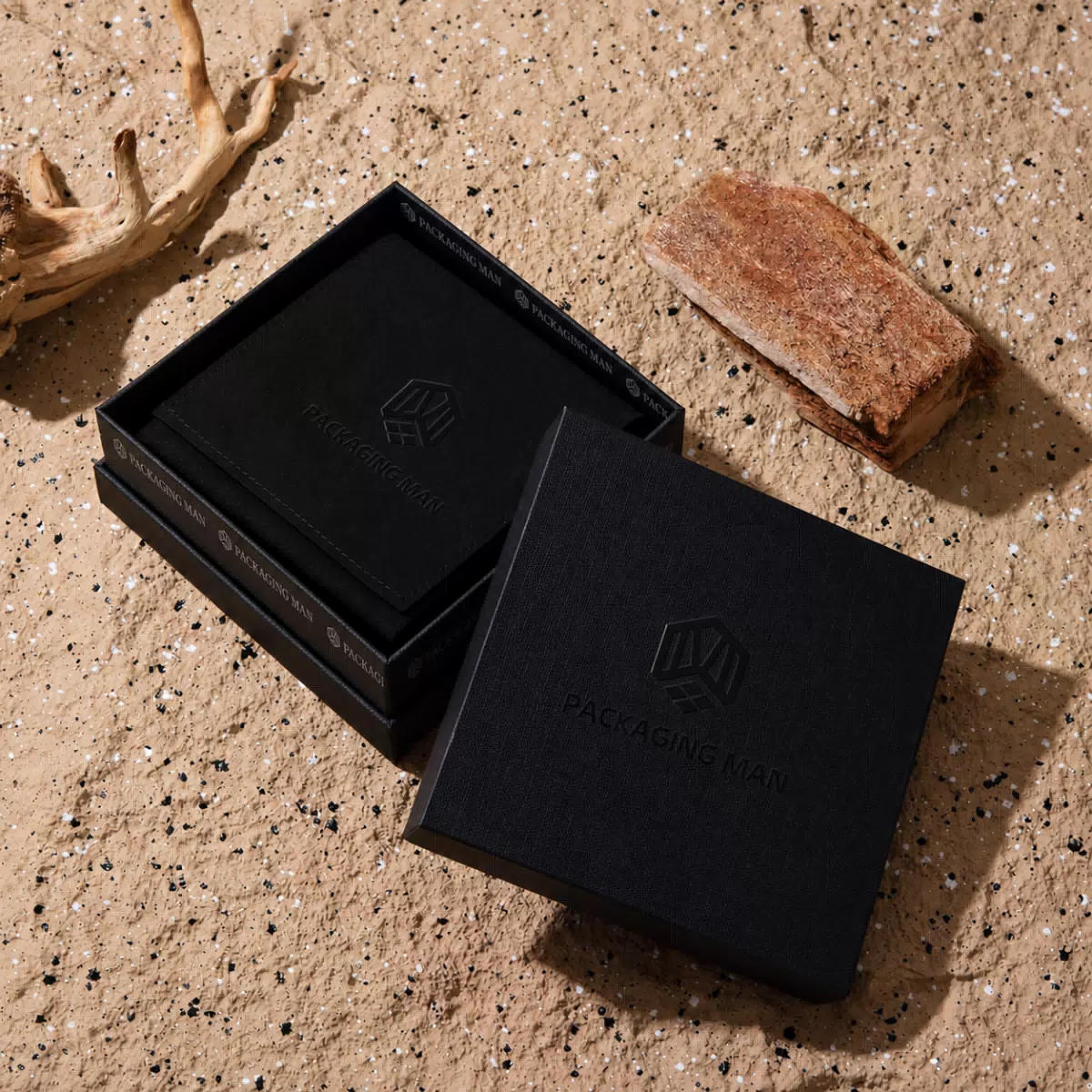 Open black rigid box with inner tray