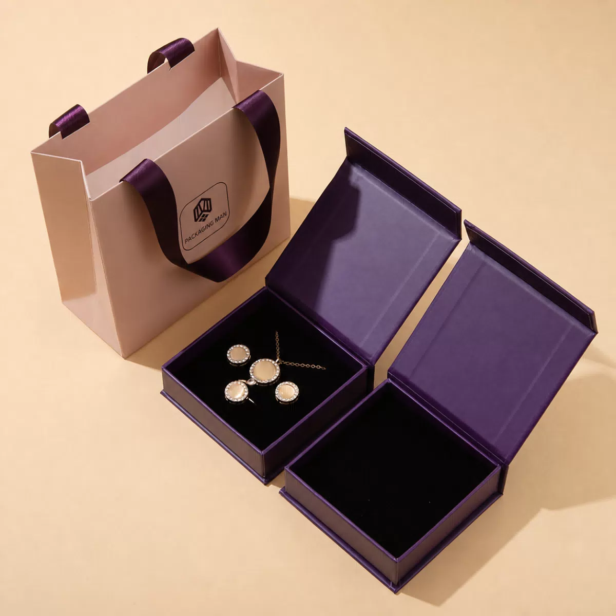 Two open purple rigid gift boxes packaging