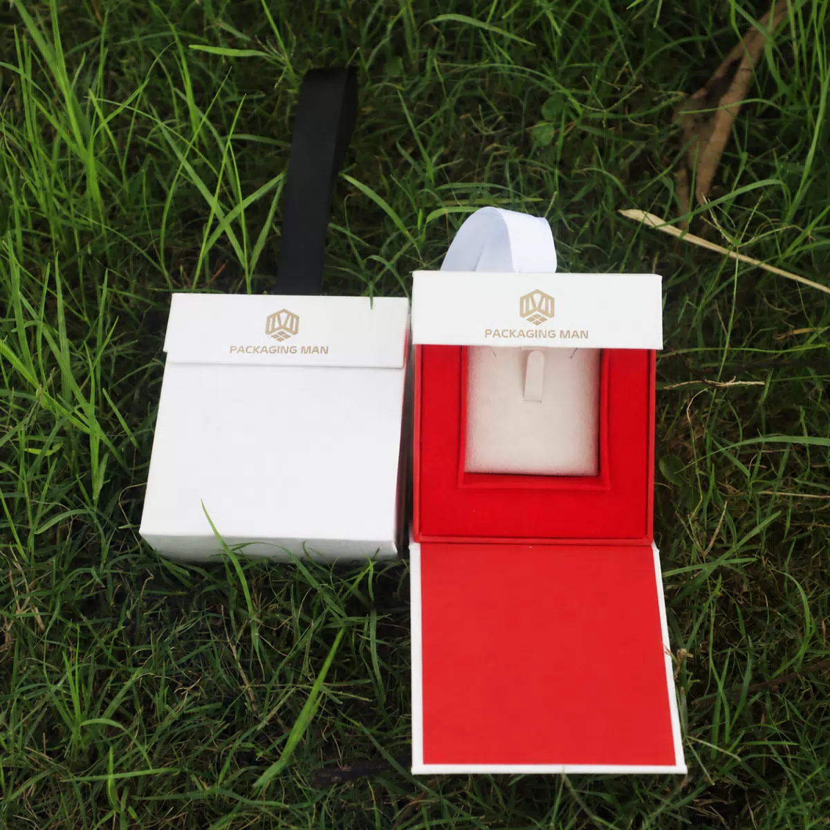 White rigid gift box with red interior insert