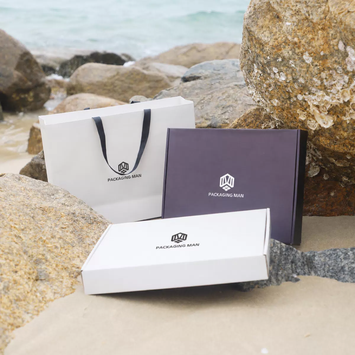 White paper bag and rigid boxes on rocks