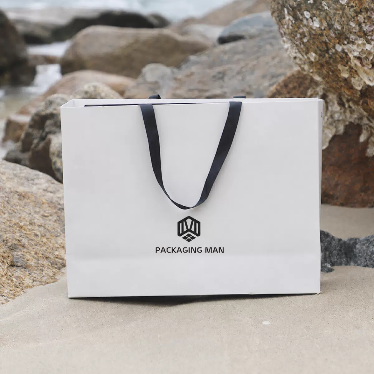 White custom paper bag with black handles