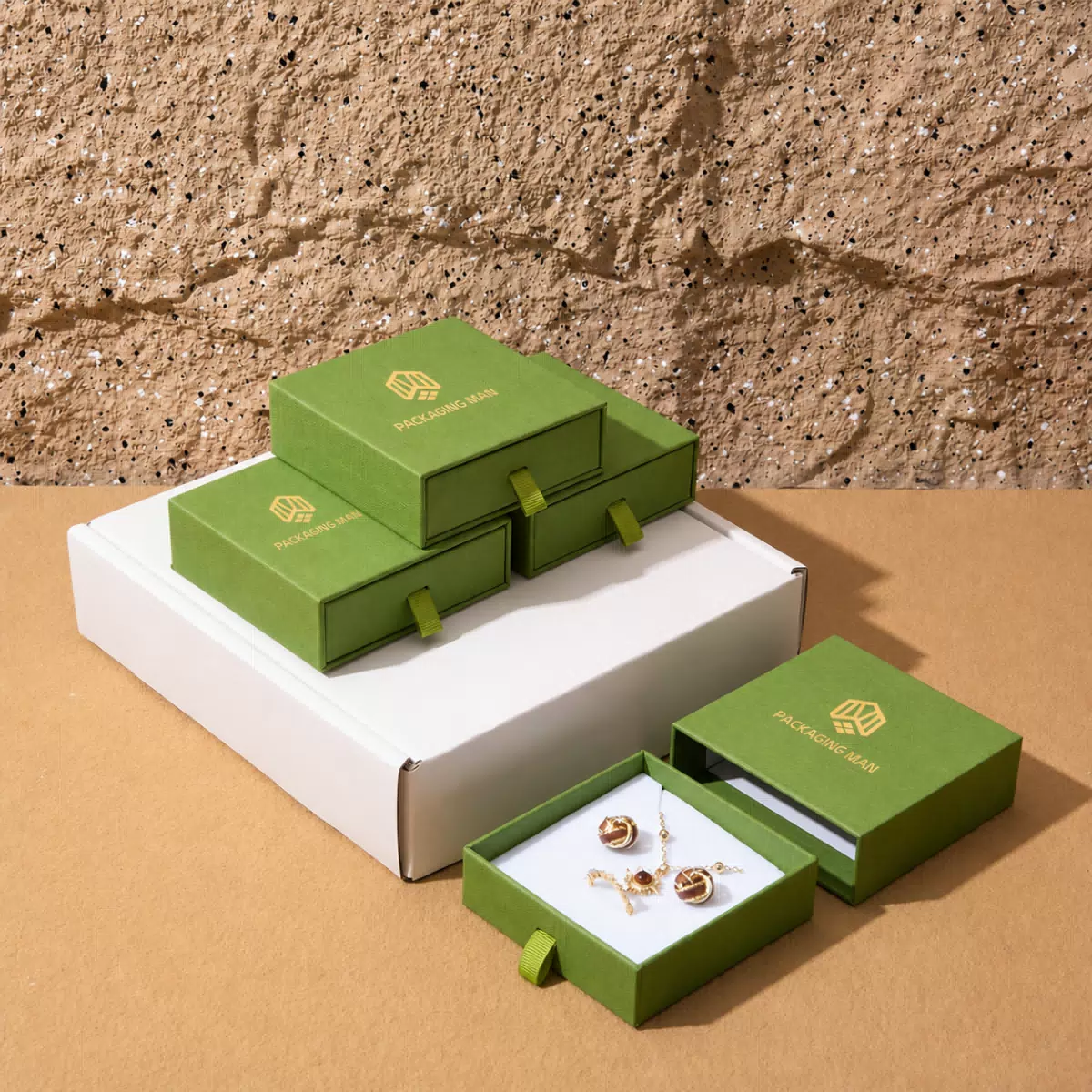 Green drawer gift boxes on white mailer