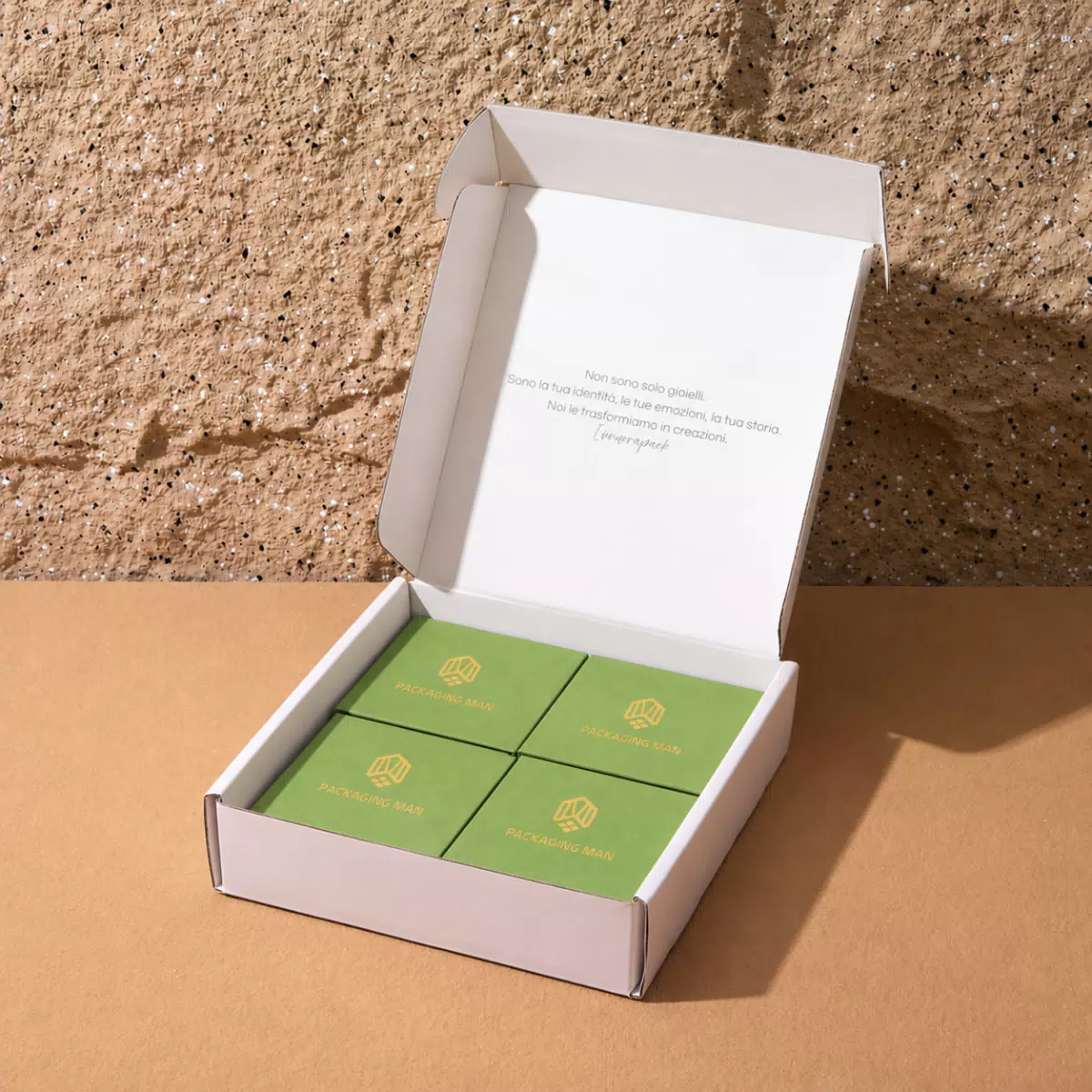 Open white mailer box with green inserts