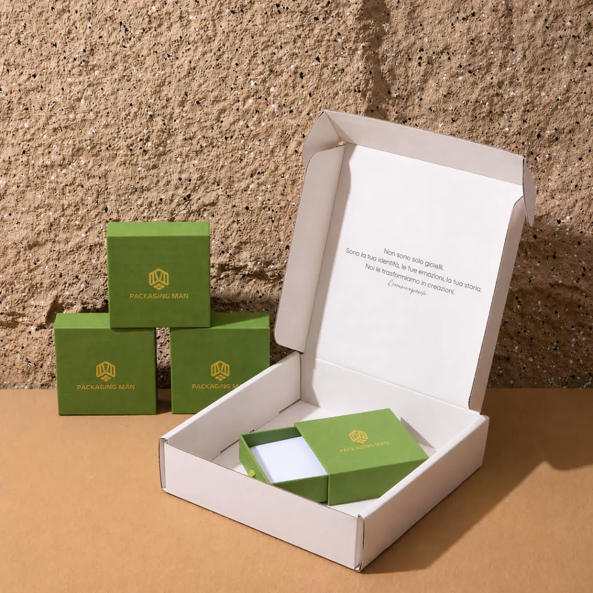 Stacked green rigid boxes and open mailer