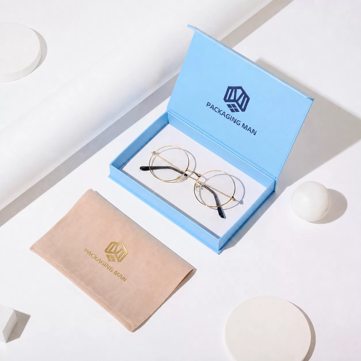 Open blue gift box with glasses inside