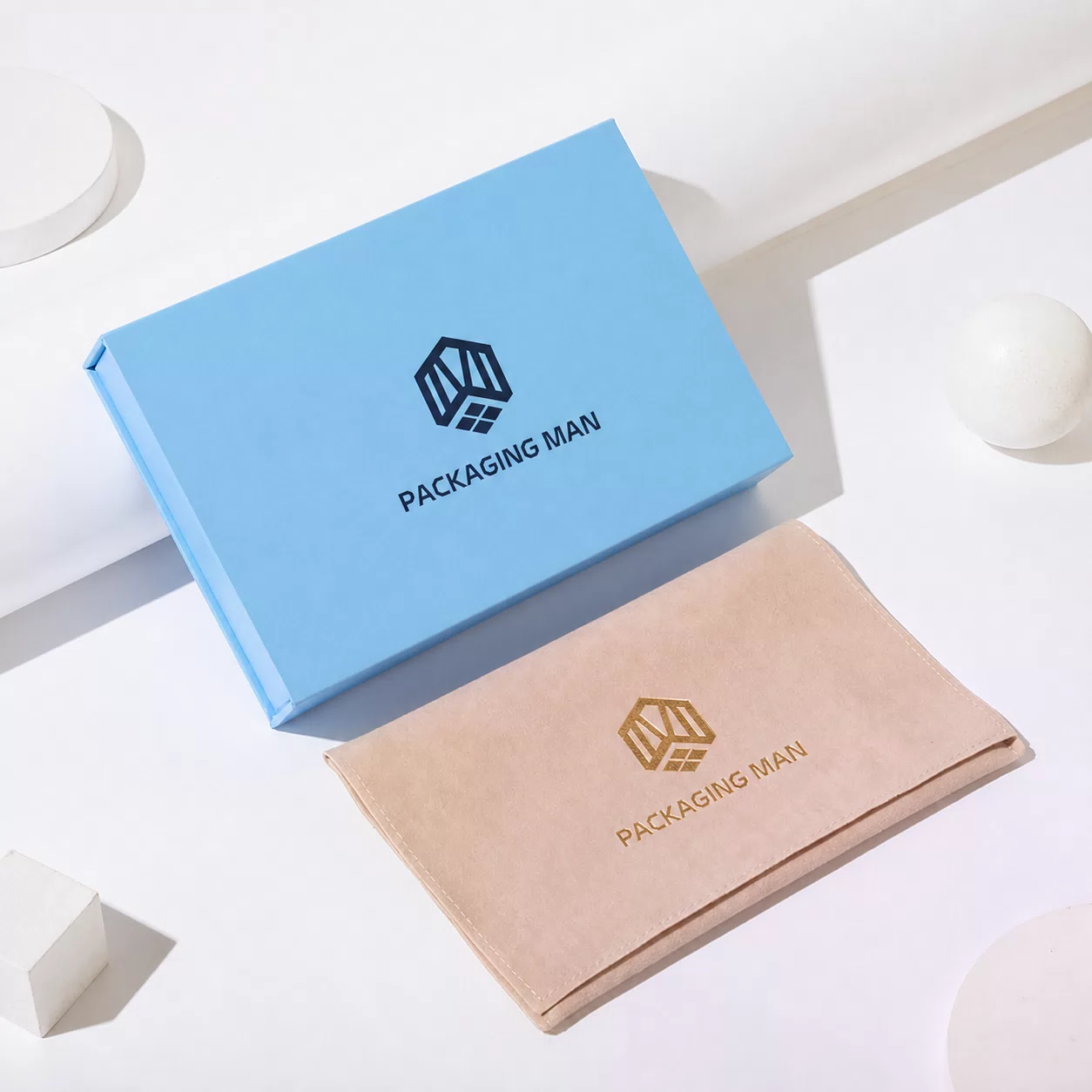 Closed blue rigid box and beige pouch