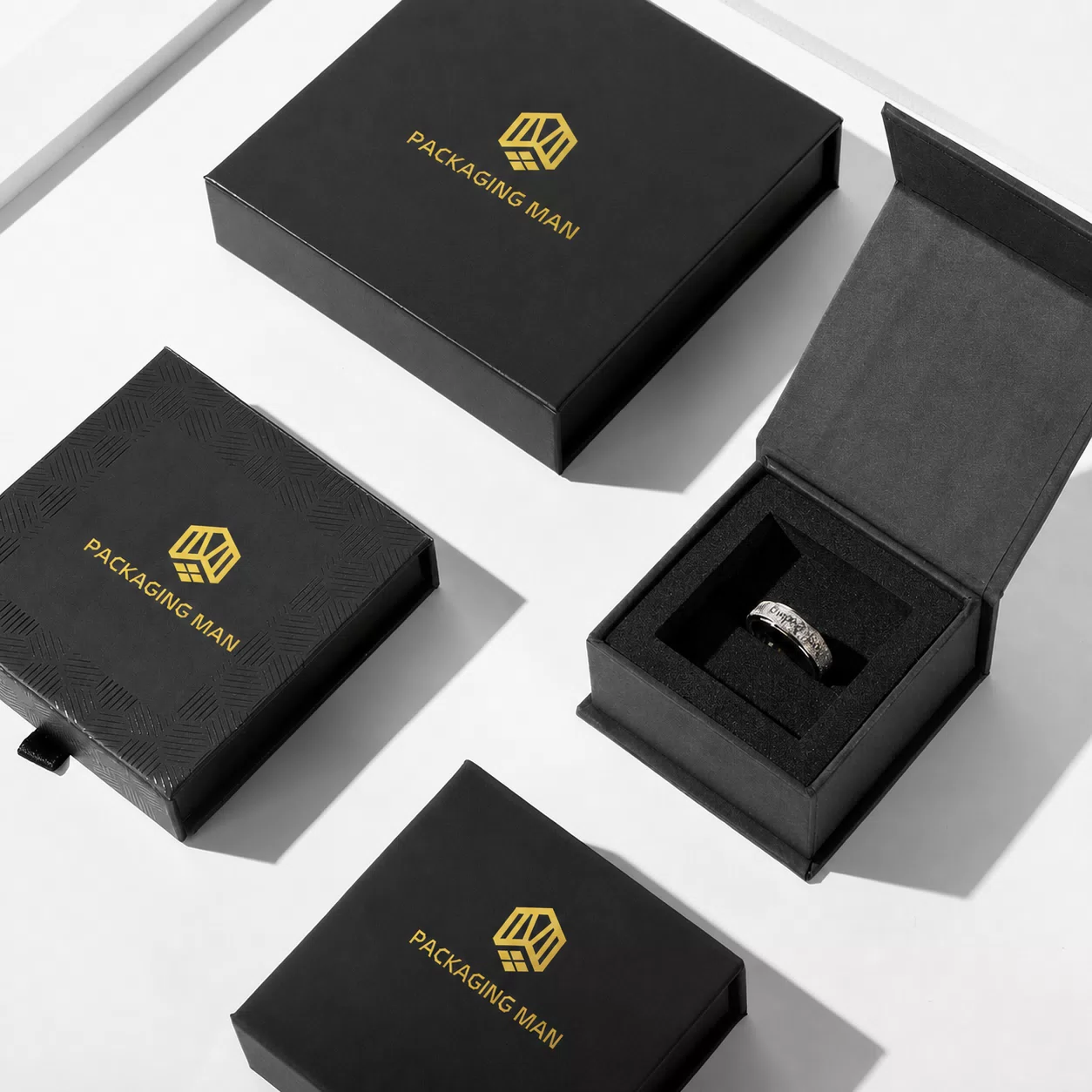 Open black jewelry box with ring insert