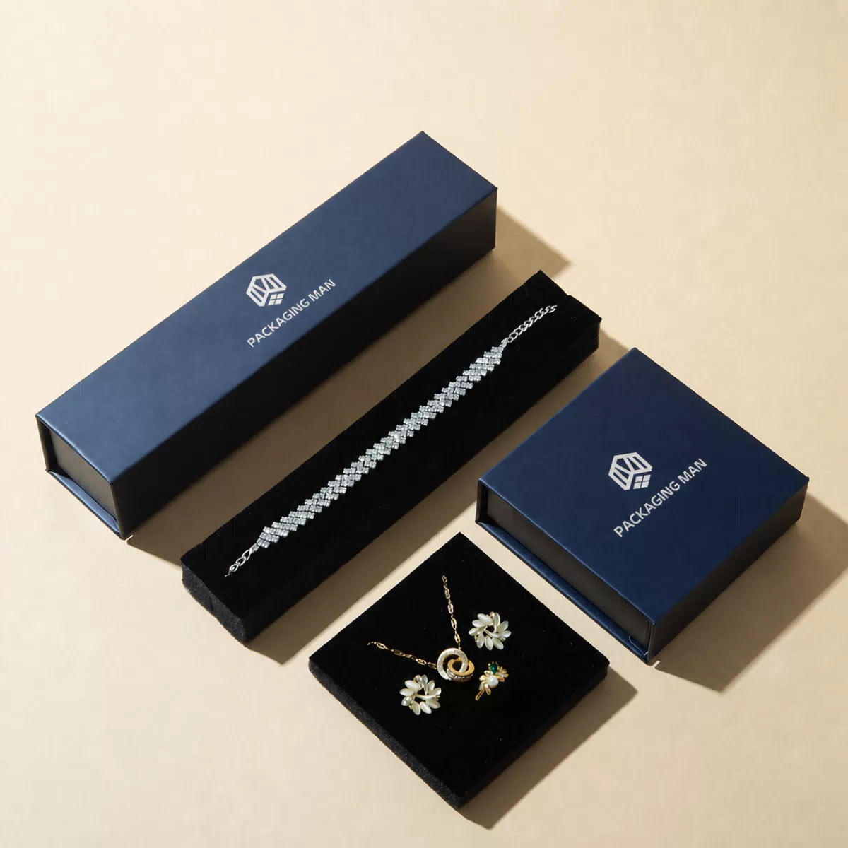 Dark blue rigid gift boxes with black inserts
