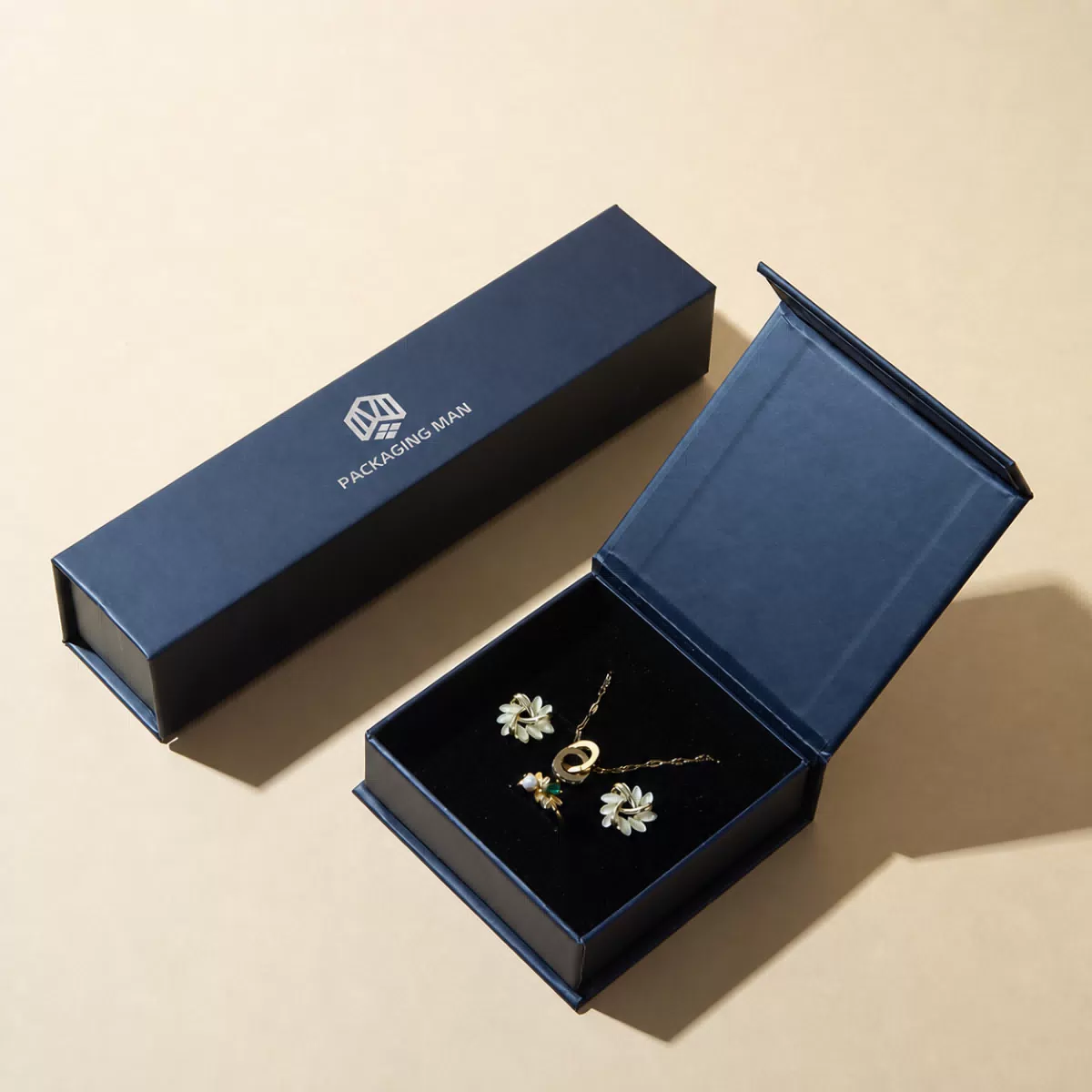 Open dark blue hinged gift box with insert