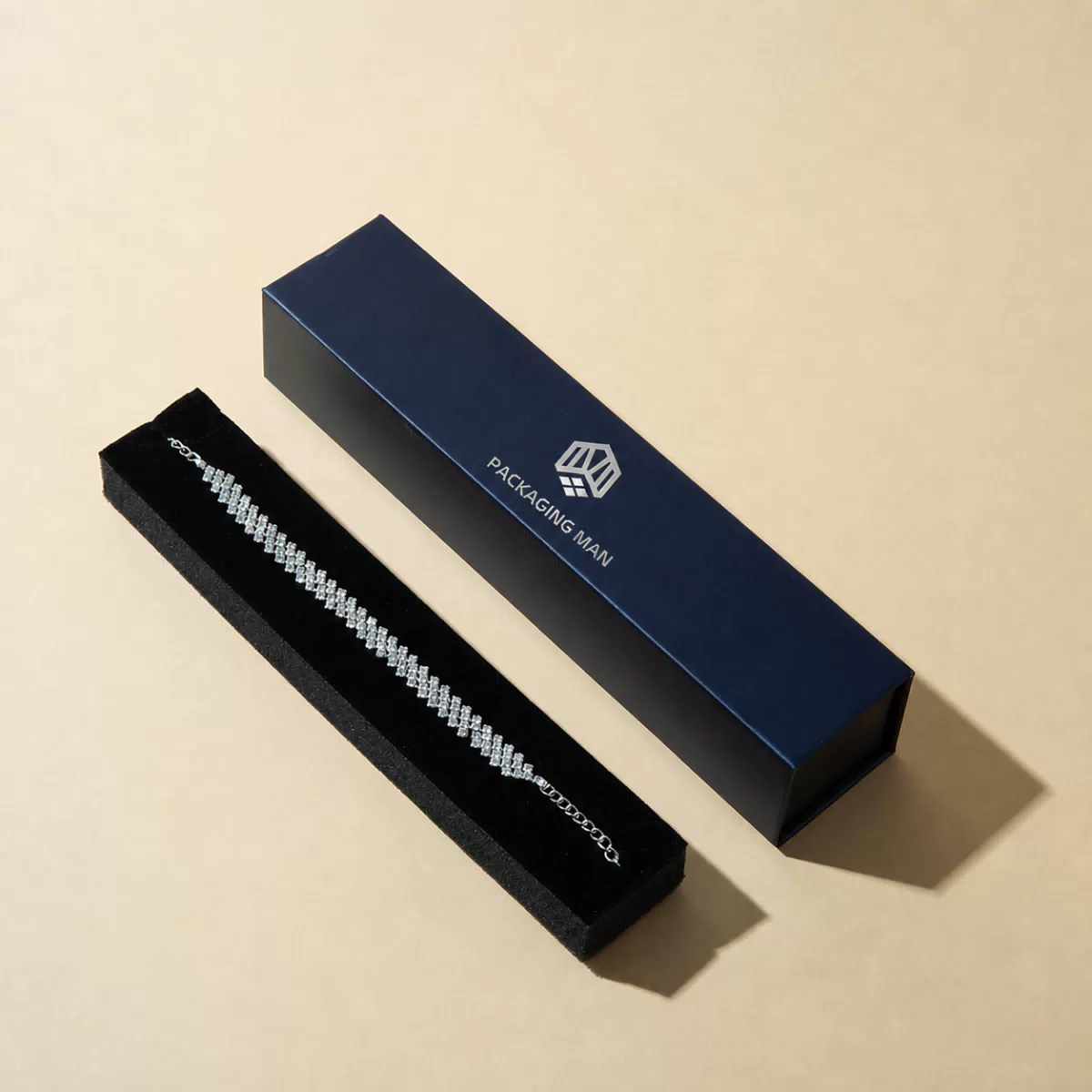 Long navy blue box with black velvet tray