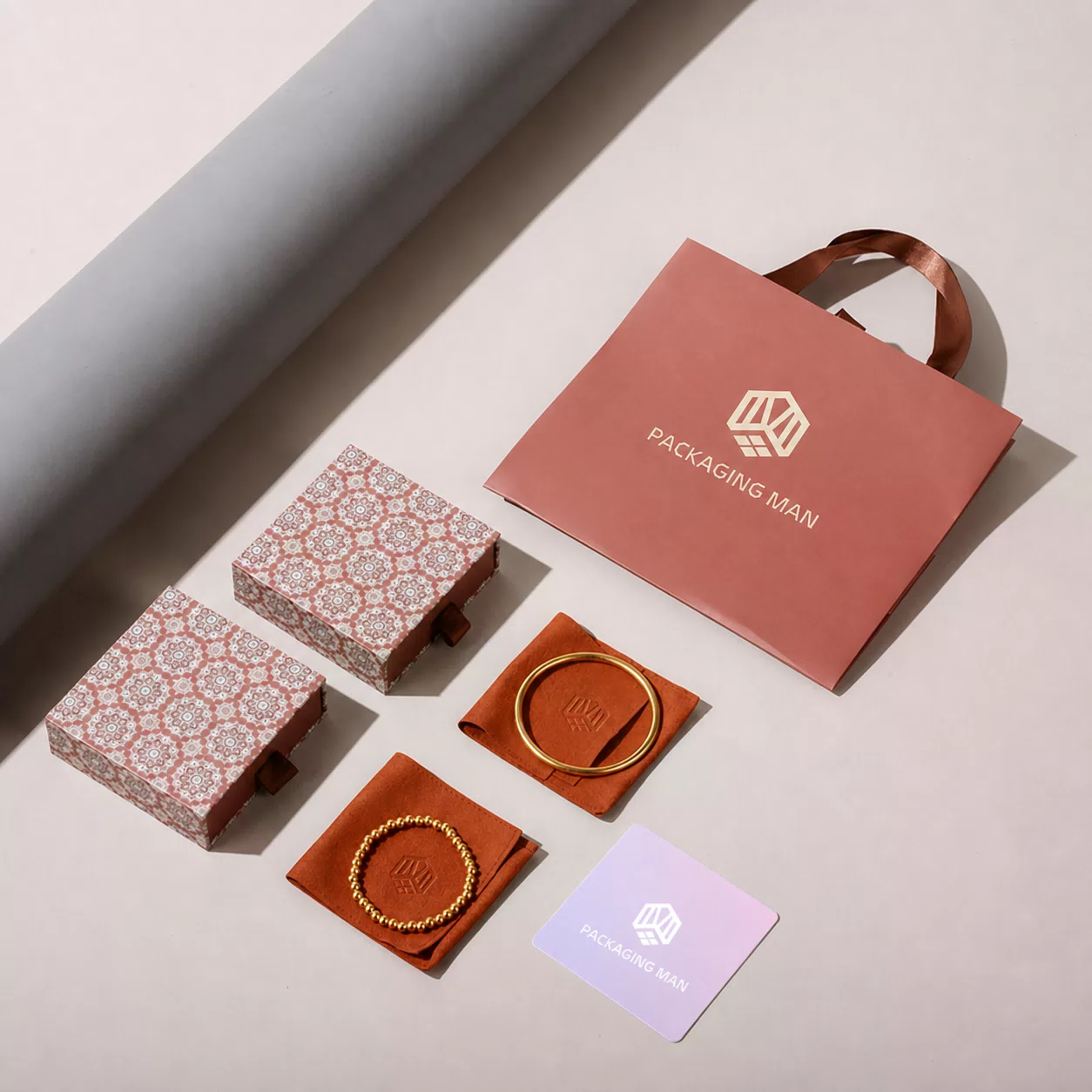 Pink drawer boxes with orange velvet pouches