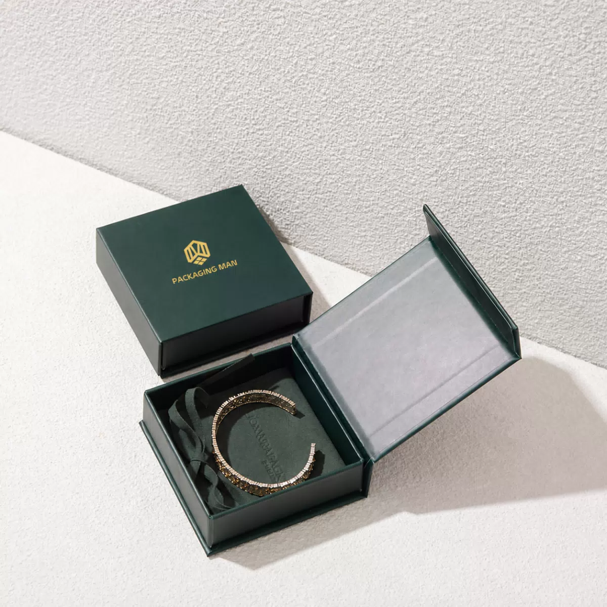 Dark green rigid gift box with open lid