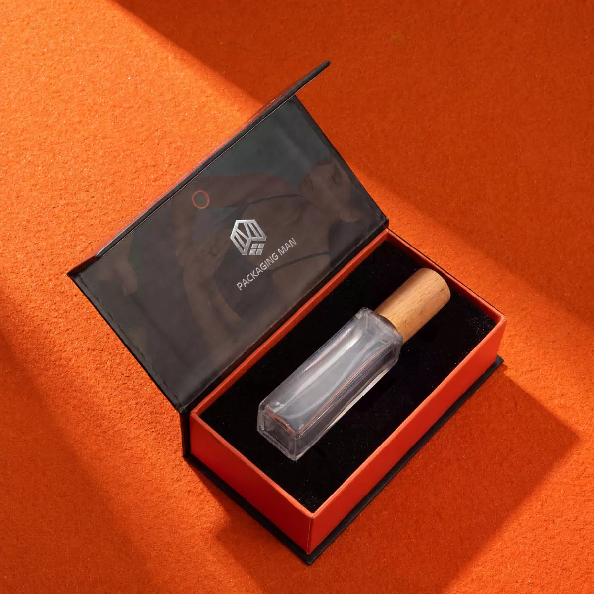Open black gift box with bottle insert