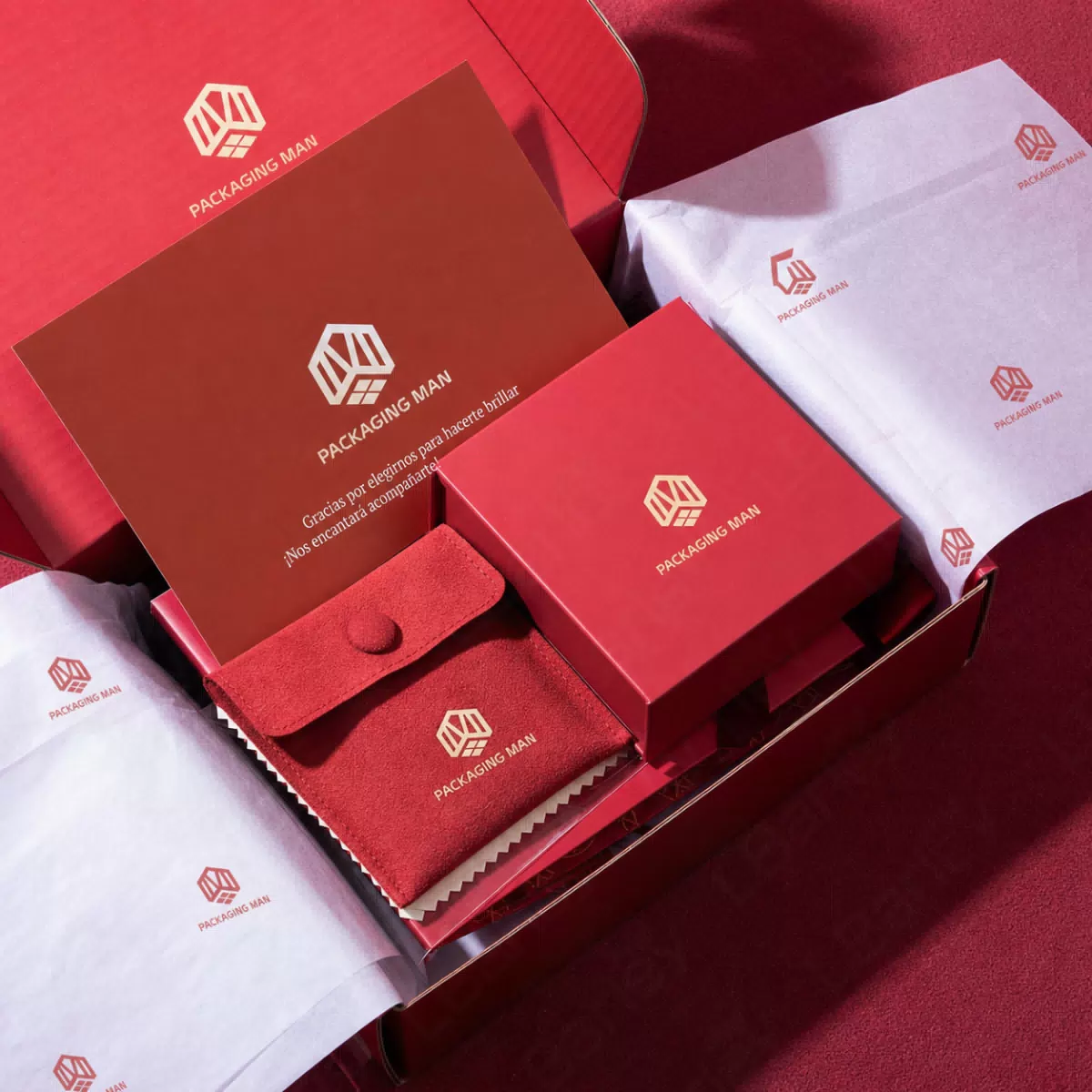 Red rigid box and pouch inside mailer