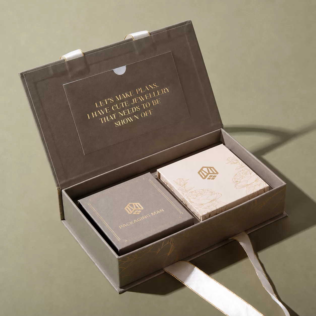 Open grey rigid gift box with inner trays