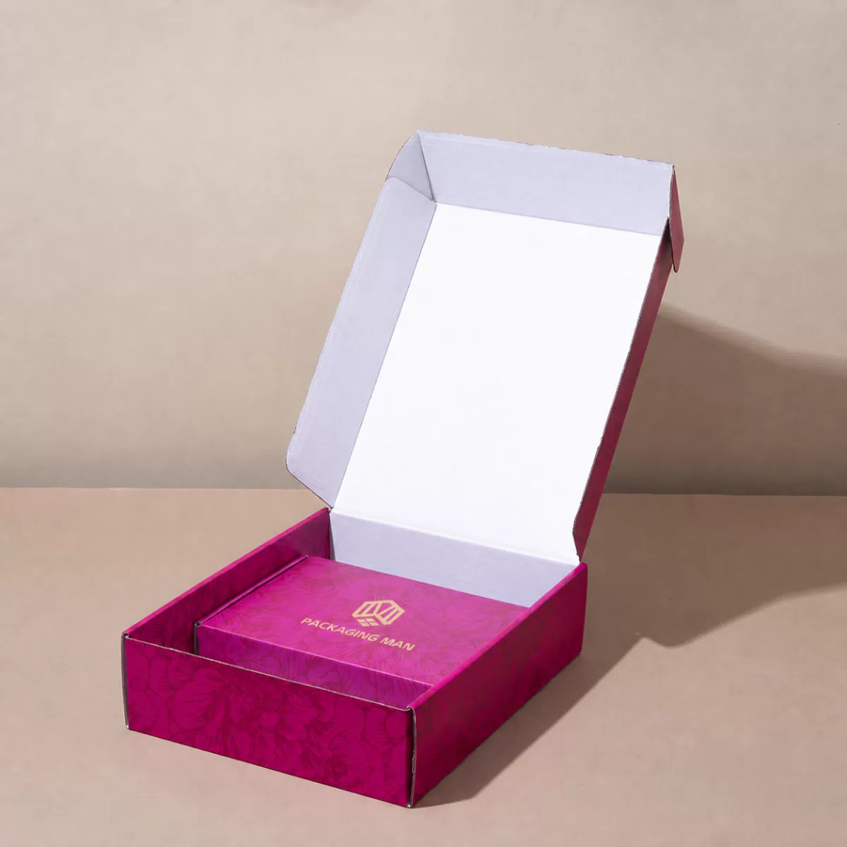 Open magenta gift box with inner tray