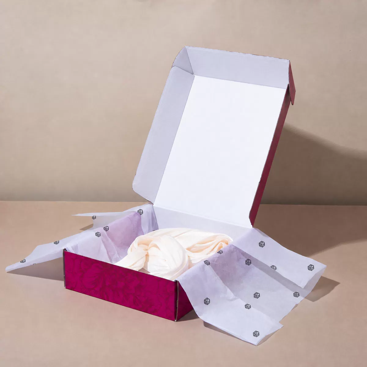 Magenta box with patterned tissue paper