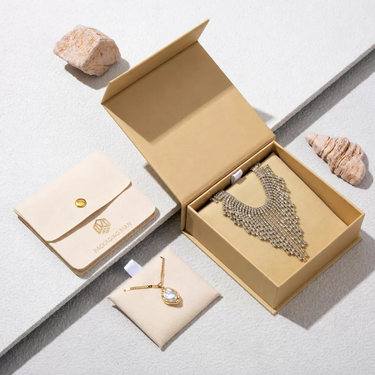 Open beige rigid gift box with necklace