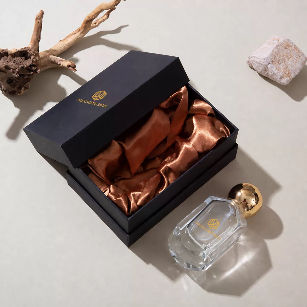 Open black gift box with bronze lining