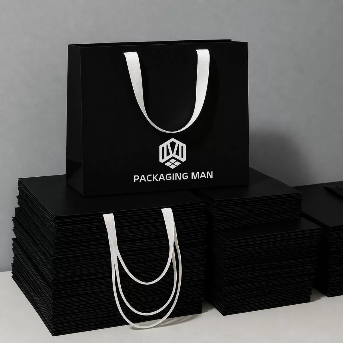Black custom paper bag with white ribbon handle