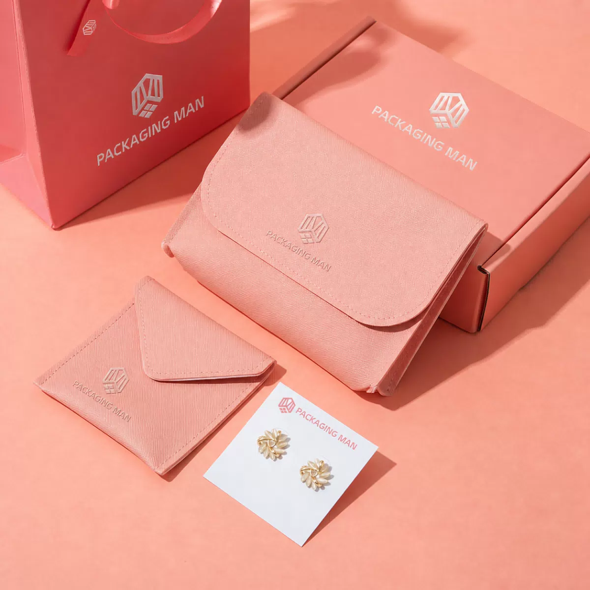 Pink packaging box and accessory pouches