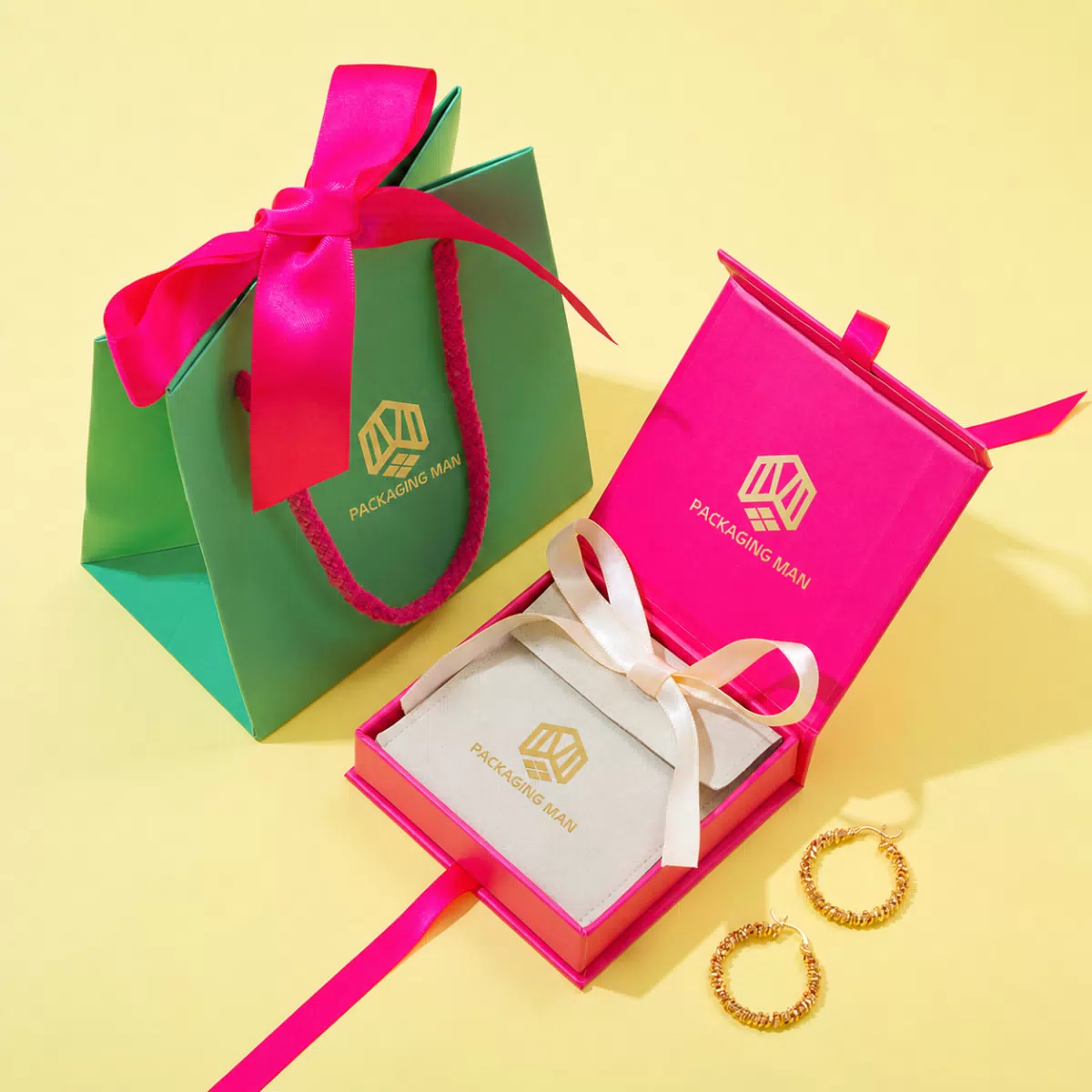 Open pink gift box with paper bag