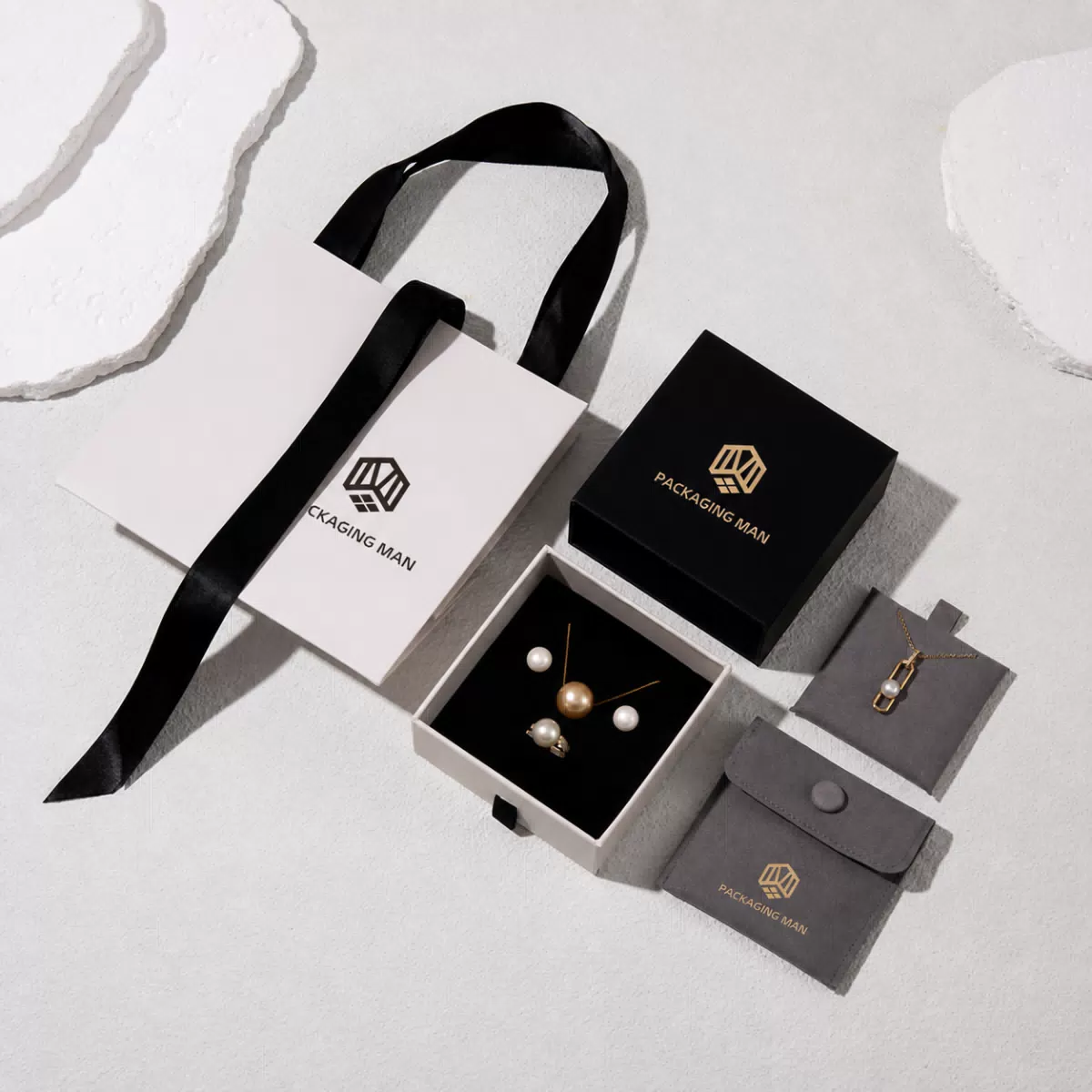 White rigid gift box with black paper bag