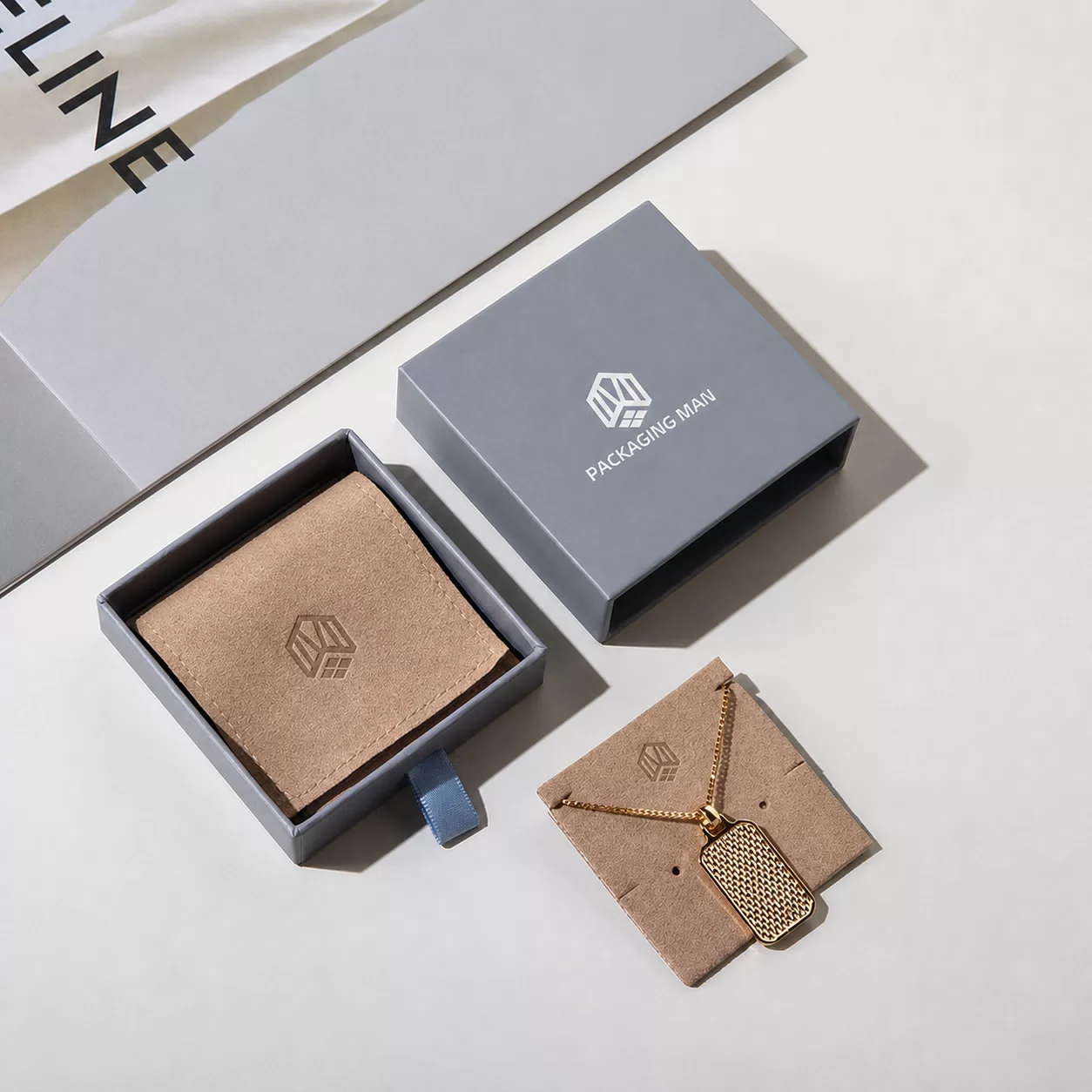 Grey drawer box packaging with necklace display