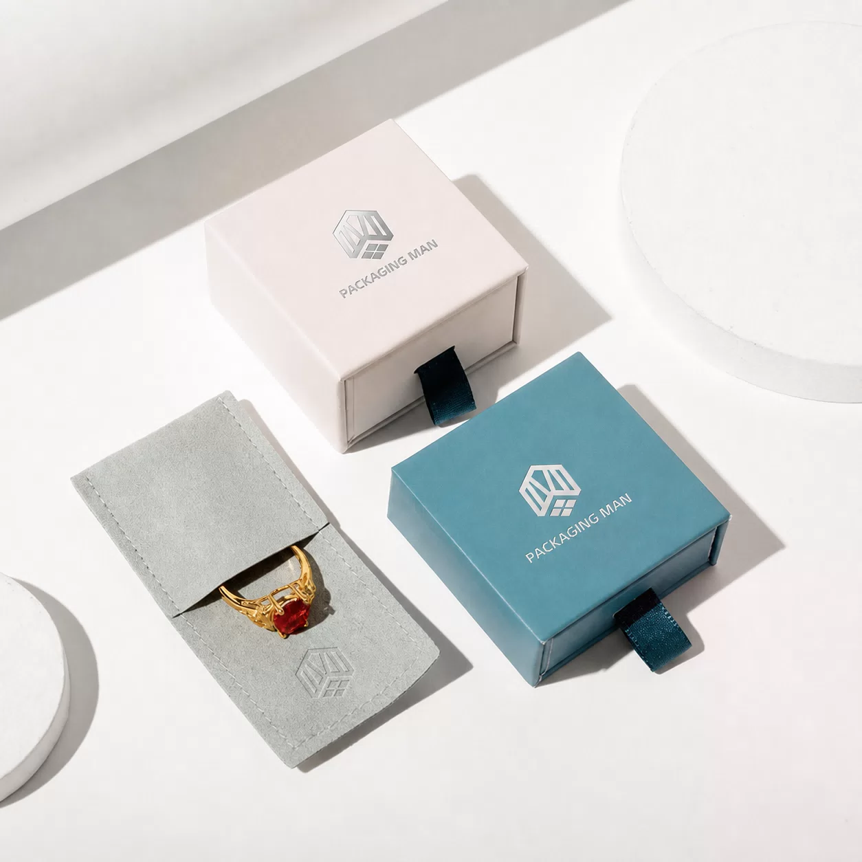 Beige and teal drawer boxes with ring pouch