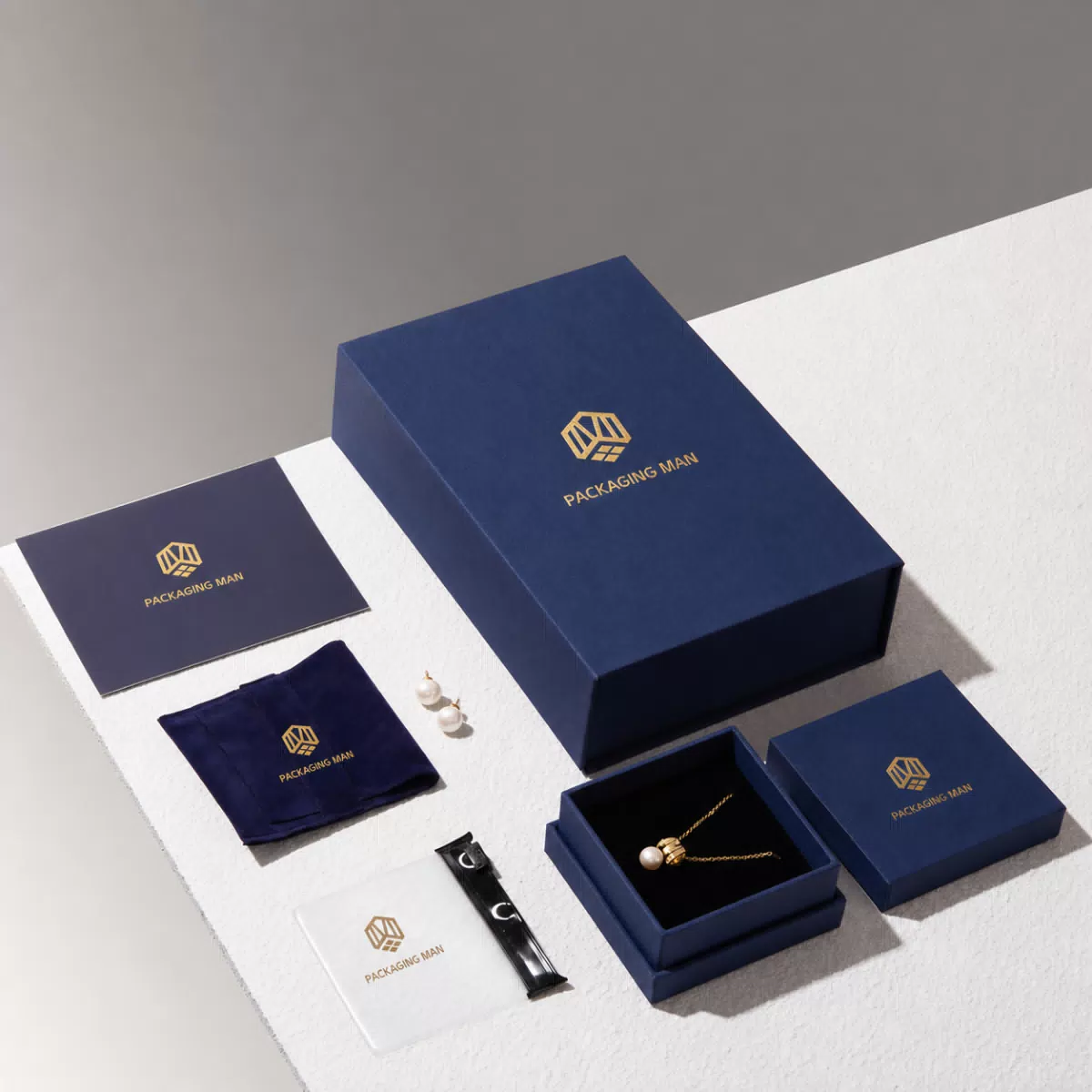Closed blue rigid box with matching packaging components